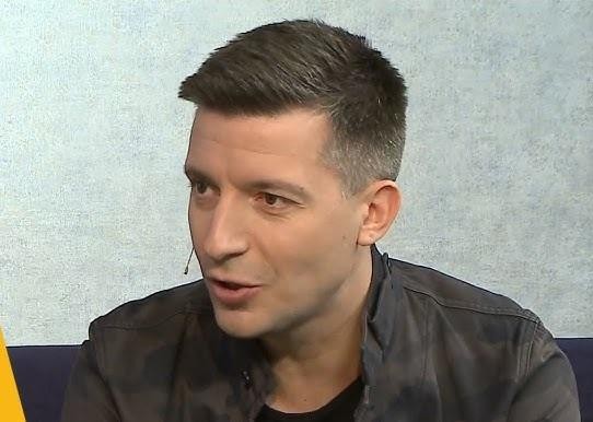 Ekran smartfona z profilem Michała Cessanisa na Instagramie, przedstawiający jego zdjęcia z podróży i liczbę obserwujących.