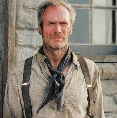 Clint Eastwood w scenie z klasycznego westernu, przedstawiający go jako rewolwerowca w charakterystycznym poncho, symbolizującego jego ikoniczne role.